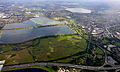 Image 3Seven reservoirs. View of four in Spelthorne with small lakes of lower elevation, from aggregate extraction, in the south of the borough to the right. Beyond three reservoirs in Elmbridge. The flattest areas of the far north of the county. Staines road and rail bridges span the Thames into Runnymede in the right of the photograph. (from Portal:Surrey/Selected pictures)