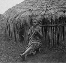 Gusii woman sitting in front of a hut ca.1916-1938 Kisii native sitting in front of hut.jpg
