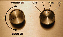 Two control knobs for a heating/cooling system. The left knob controls the temperature while the right controls the fan speed. Knobs-for-climate-control.jpg