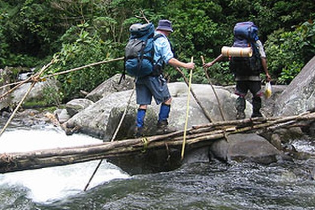 Crossing Eora Creek on the Kokoda Track