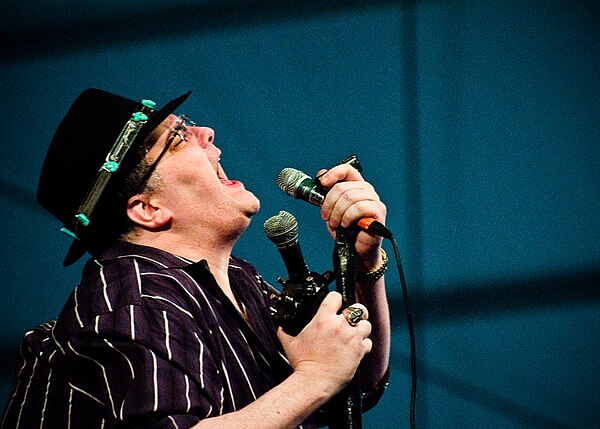 Popper's trademark hat and custom modified harmonica microphone