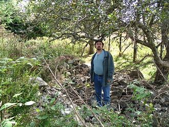 The remains Ranald MacKinnon's home, Sargeant's Hill in Glenwood, Nova Scotia. The pear trees are likely his original plantings. Remains of Ranald MacKinnon home.jpg