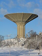 The mushroom-shaped concrete water tower of Roihuvuori in Helsinki, Finland was built in the 1970s. It is 52 metres (171 ft) high and can hold around 12,000 cubic metres (420,000 cu ft) of water. Roihuvuori water tower - Helsinki Finland.jpg