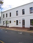 These historic double-storeyed houses were erected in about 1841 as residences for Coloured people and freed slaves and their descendants. Slavenhuis, 39 Herte Street, Stellenbosch.JPG