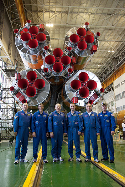 File:Soyuz TMA-10M crew in front of their booster rocket.jpg