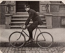 Bicycle-mounted NYPD officer in the 1890s The Great north side, or, Borough of the Bronx, New York (1897) (14761947351).jpg