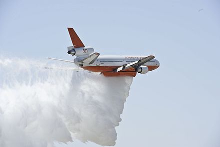 A DC-10 Tanker operated by a private contractor for the U.S. Forest Service demonstrates a water drop during "Thunder Over The Empire Air Fest" at March Air Reserve Base, Calif. (2012)