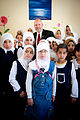 Tim Lowery, back row, center, with U.S. Provincial Reconstruction Team poses for a photo with the Iraqi children in Taji, Iraq, March 20, 2011 110320-A-IN286-012.jpg