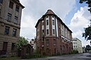 Entrepôt central de l'association des consommateurs avec bureaux et appartements ainsi que boulangerie et boucherie