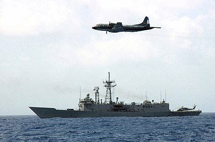 A US guided missile frigate and an Argentine maritime patrol aircraft during joint operations in Panama.
