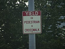 A sign warning motorists to yield to those crossing the crosswalk Yield for People in Crosswalk.JPG