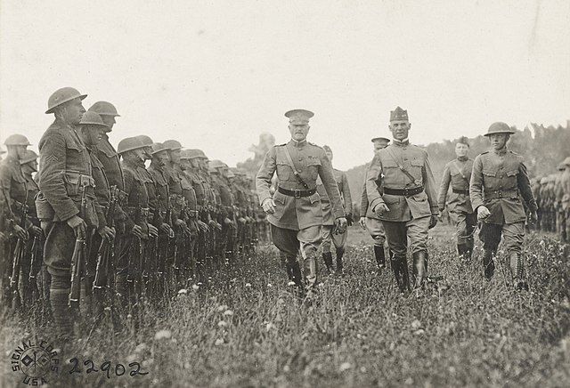 General John J. Pershing, Commander'in-Chief of the AEF, and Major General Charles P. Summerall, commander of the 1st Division, inspecting doughboys o