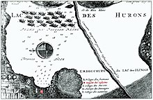 A 1717 map of St. Ignace showing the location of the Jesuit Mission (in red at lower middle-left) on East Moran Bay (north is to the left) 1717 Map of St Ignace.jpg