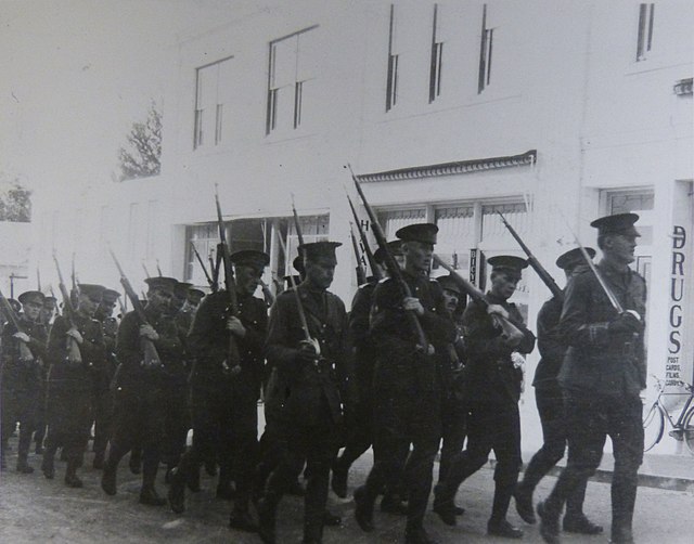 Members of the 38th Battalion (Ottawa), CEF marching in the streets of Hamilton, Bermuda, in 1915.