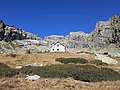 * Nomination The alpine bivouac Rifugio Regi in Italy. --Mænsard vokser 17:42, 14 October 2020 (UTC) * Decline Very good composition. But I think it is lacking detail and its underexposed. Could you please reduce noise reduction and try to light it up a bit? Or was there a polarisation filter used? --Augustgeyler 09:56, 20 October 2020 (UTC) Viewed at 100% it appears over-processed to me. Too much sharpening? --Tagooty 03:40, 23 October 2020 (UTC) This picture was taken with a cell phone so, there's not much I can do to improve it. I'll try to light it up a bit.--Mænsard vokser 09:19, 23 October 2020 (UTC)  Oppose I am sorry, but as there is no room for improvement due to the cell phone source, I have to oppose. --Augustgeyler 09:22, 26 October 2020 (UTC)