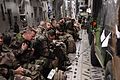 French troops prepare for take-off inside a U.S. Air Force C-17 Globemaster III cargo aircraft in Istres, France