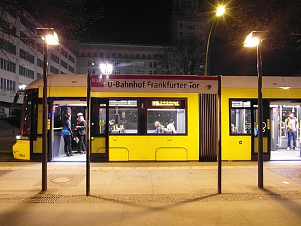 Flexity low-floor tram at level-entry station in Berlin - the goal is to have all bus and tram stations getting a matching kerb
