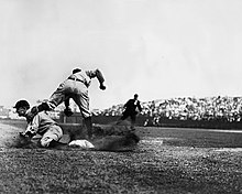 Charles M. Conlon's famous picture of Cobb stealing third base during the 1909 season Cobb slide into third.jpg