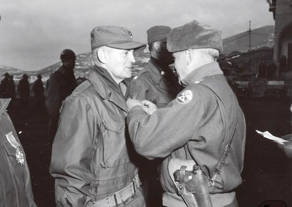 Colonel Edward H. Forney, Deputy Chief of Staff of X Corps, receiving the Legion of Merit by Major General Edward Almond, commander of X Corps, for hi
