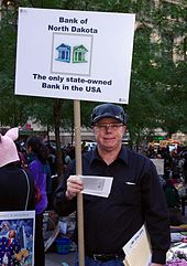 A man in October 2011 advertising the bank at Occupy Wall Street. Day 21 Occupy Wall Street October 6 2011 Shankbone 3.JPG