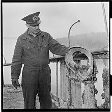 Captain Erling Erichsen, Donau's former commander, assessing the condition of the wreck after she was raised in 1952 Donau. NA nr. 8 - Fo30141602240029.jpg