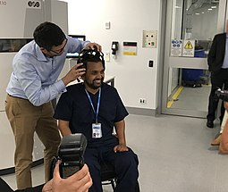 Dr Dinesh Palipana OAM being photographed at Griffith University's Advanced Design and Prototyping Technologies Institute, where he co-leads the innovative Biospine project with Dr Claudio Pizzolato. Dr Dinesh Palipana OAM Biospine lab.jpg