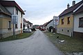 Čeština: Východní pohled do ulice Na vyhlídce v Okříškách, okr. Třebíč. English: East view of Na vyhlídce street in Okříšky, Třebíč District.