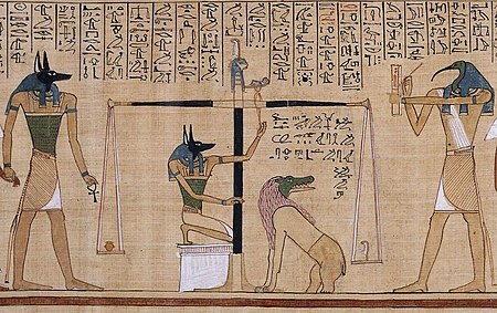 Detail from the Papyrus of Hunefer (c. 1275 BCE) depicts the jackal-headed Anubis weighing a heart against the feather of truth on the scale of Maat, while ibis-headed Thoth records the result. Having a heart equal to the weight of the feather allows passage to the afterlife, whereas an imbalance results in a meal for Ammit, the chimera of crocodile, lion, and hippopotamus. El pesado del corazon en el Papiro de Hunefer.jpg