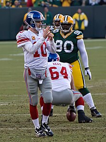 New York Giants quarterback Eli Manning calls for a time-out during a 2011 National Football League game. Eli Manning timeout.jpg