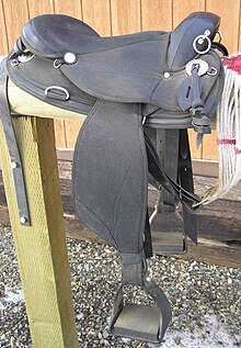 Endurance saddle, based on a western design, with a 3/4 rigging, placing the rider more directly over the stirrups and over the center of gravity of the horse. A similar tree without a horn is used for saddles used by saddle bronc riders/ EnduranceSaddle.jpg