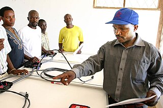 Makale (right, in hat) teaching a solar workshop in Kigoma, Tanzania, May 2005. Gaspar makale.jpg