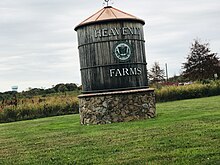 Watertower-like sign near the entrance of Heavenly Farms