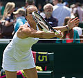 Jelena Janković competing in the first round of the 2015 Wimbledon Championships.