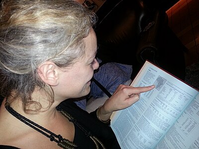 Day 54: Wikimedia Foundation Executive Director Katherine Maher, looking up Ghana in the Encyclopedia Britannica, during a visit to Ghana