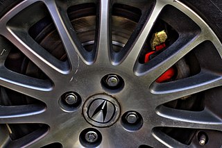 Lug nut fastener, specifically a nut, used to secure a wheel on a vehicle