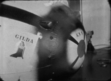 The Able bomb, a Mark III 'Fat Man'-type nuclear bomb with its nickname 'Gilda' stenciled onto it, along with a photo of Rita Hayworth in the title role from the movie. Mark III Nuclear Bomb nicknamed 'Gilda'.png