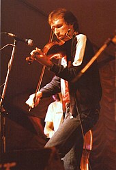 Fiddle player Mark O'Connor is a six-time winner. Mark O'Connor, bluegrass musician on stage at Cambridge Folk Festival, 1985.jpg