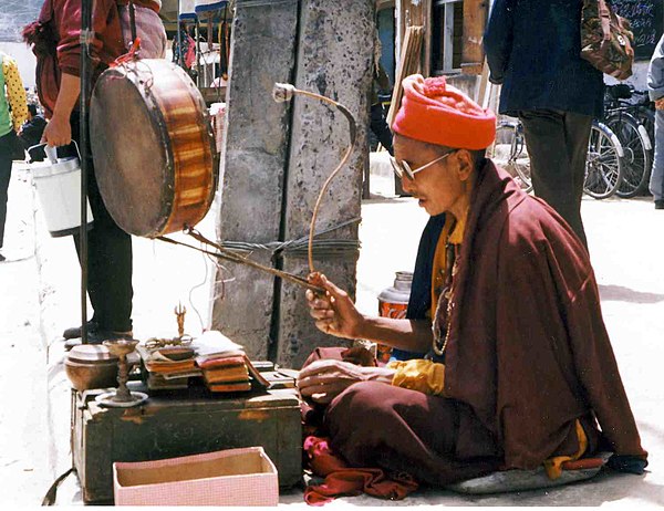 Mendicant monk reciting scriptures in Lhasa, Tibet, 1993