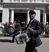 Members of the Excelsior Band (established 1883) marching down Royal Street. They are known for their Dixieland and conventional jazz. Mobile Mardi Gras 2010 44.jpg