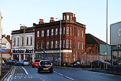 Naylor's Row along Clarence Street in Kingston upon Hull. Now occupied by a body shop and machinery store, these terraced buildings complement the Windmill Hotel opposite as some of the most notable historical buildings immediately off Holderness Road. The dome on top of the closest building may not be original, as Google Street View imagery suggests this was installed between 2012 and 2014, and it appears to be lacking in any dome roof at all.