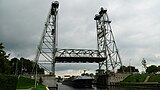 Hefbrug Gouwsluis met passerende Containerschip MUGUET.