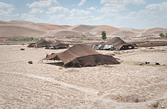 Image 14Tents of Afghan nomads in the northern Badghis province of Afghanistan. Early peasant farming villages came into existence in Afghanistan about 7,000 years ago. (from History of Afghanistan)