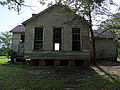 Old building at Bethel Grove Baptist Church cemetery, located near 6292 Mt Laurel Road, Clover, Virginia. East side shown. The building seems like it might have been an old school.