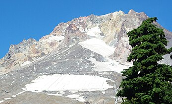 Mount Hood seen from the south. Crater Rock, the remnants of a 200-year-old lava dome, is visible just below the summit.