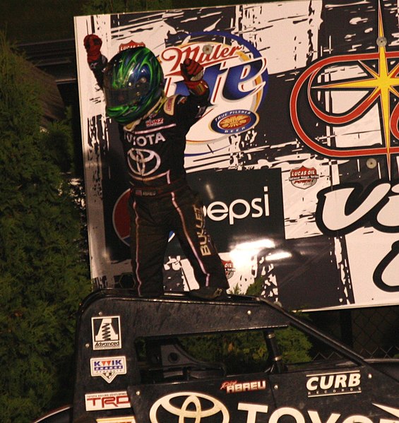 Abreu celebrating after winning his first USAC National midget car race in 2013 at Angell Park