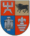 A coat of arms divided into four sections, the top left and bottom right of which are red, the bottom left of which is blue, and the top right of which is brown