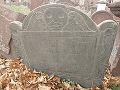 Slate Tombstone from 1740 with deaths head imagery, carved in Boston