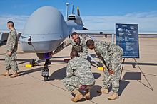 The Regiment's E Company gets a tutorial of the MQ-1C Gray Eagles Soldiers from E Company, 160th Special Operations Aviation Regiment (Airborne), explain the capabilities of the MQ-1C Gray Eagle Unmanned Aircraft System at their activation ceremony Nov. 19, 2013..jpg