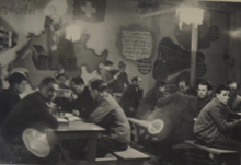 The common room in the Diepoldsau refugee labour camp in 1938, from the photo album of Leo(n) Sternbach, in the collection of the Jewish Museum of Switzerland. Tagraum im Auffanglager Diepoldsau.png