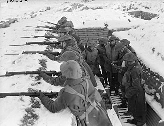 Men of the 2nd Battalion, Royal Norfolk Regiment man a snow-covered forward trench in France while hand grenades are handed out to other soldiers on 26 January 1940. The British Expeditionary Force in France, 1940 F2267.jpg